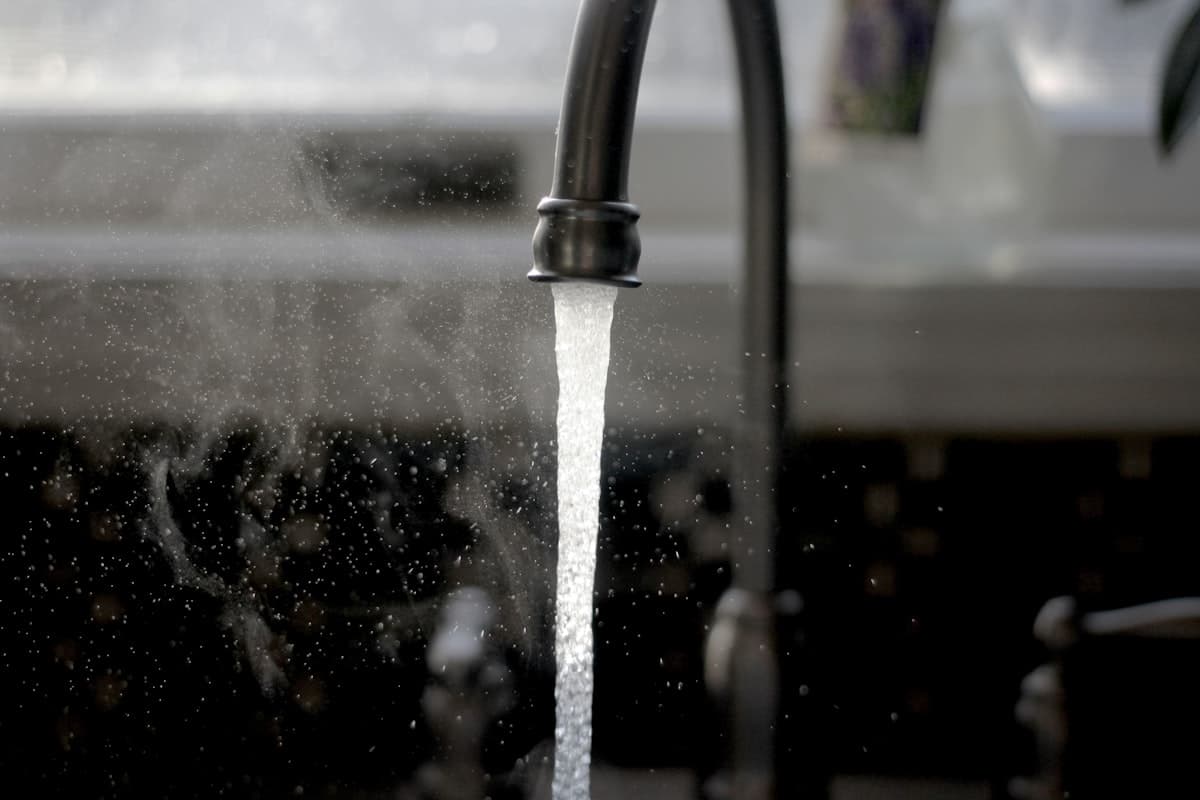 Clean water flowing from a kitchen faucet