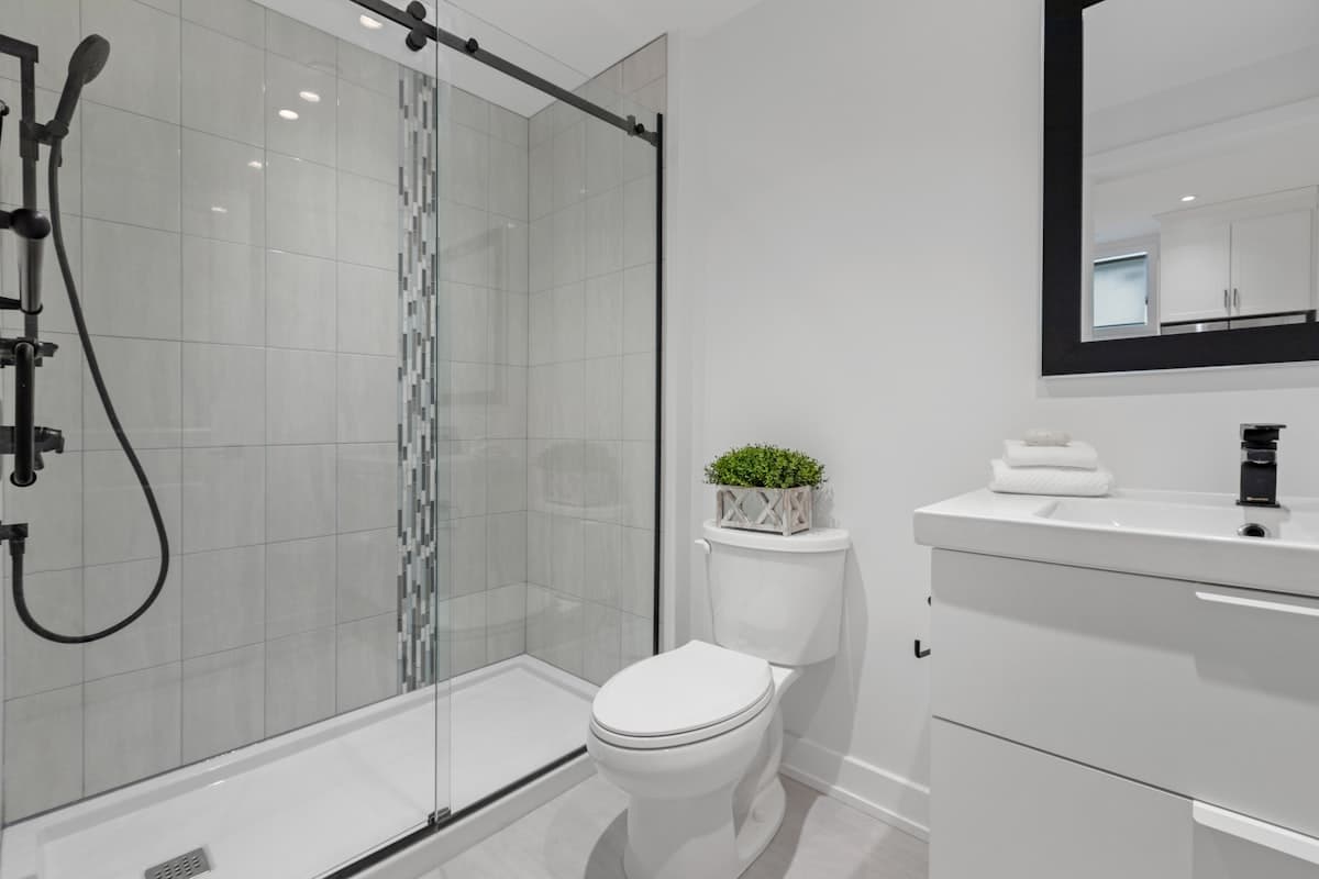 A spotless, streak-free glass shower door in a modern bathroom